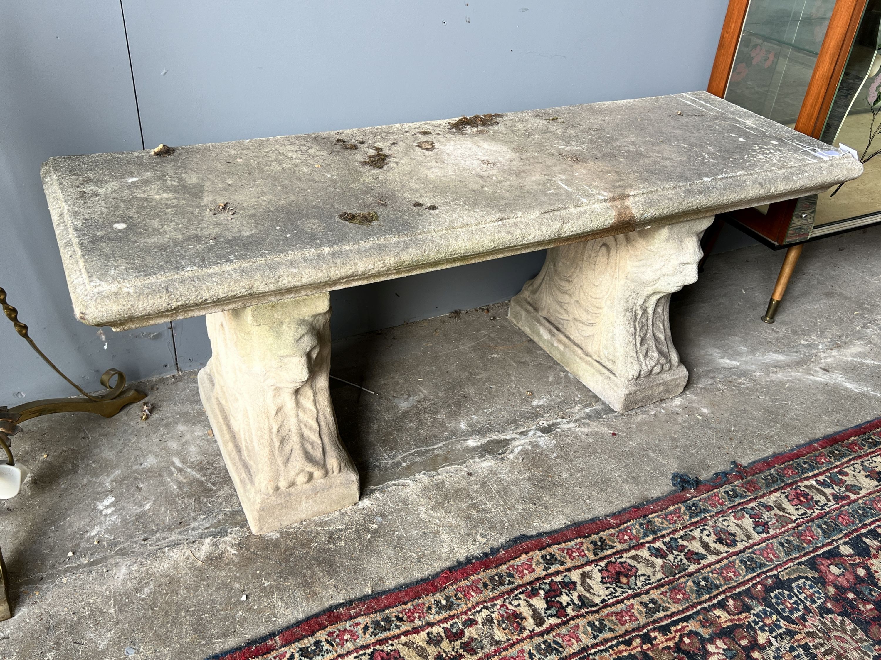 A rectangular reconstituted stone garden bench, length 126cm, depth 40cm, height 44cm